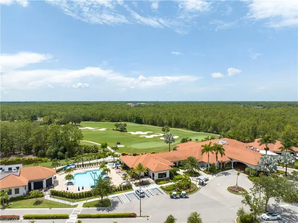 an aerial view of residential houses and outdoor space