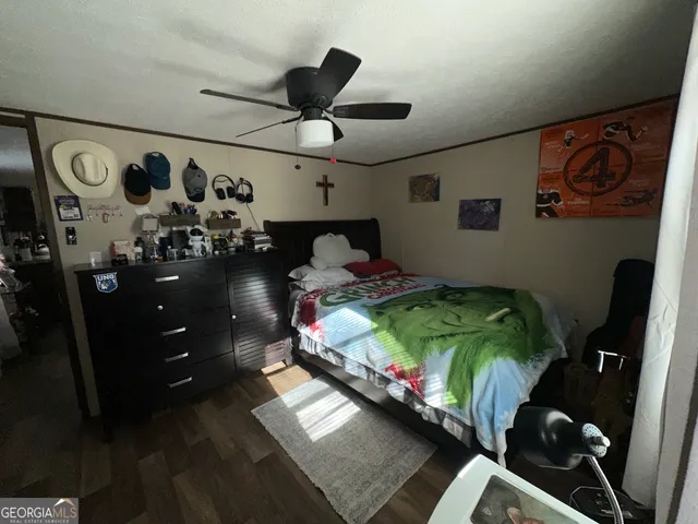 a bed room with two beds and a chandelier