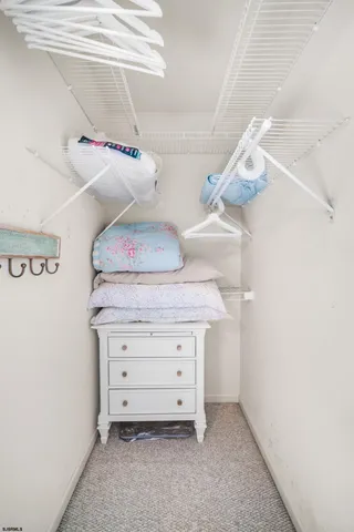 a view of a utility room with cabinets