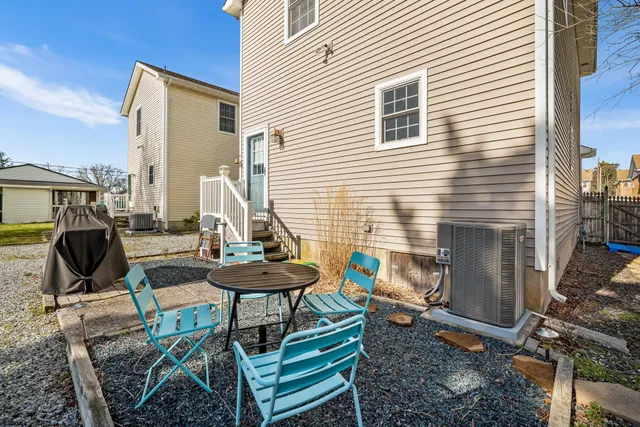 a view of a chairs and table in patio
