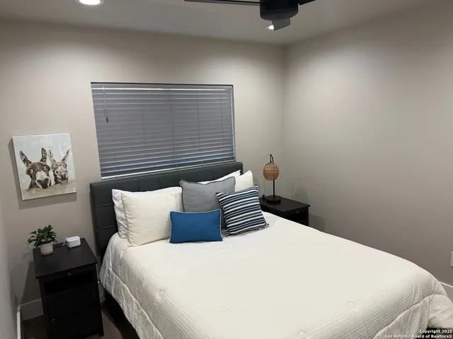 a bathroom with a sink vanity mirror and toilet