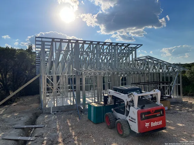 a view of a roof deck with wooden floor and fence
