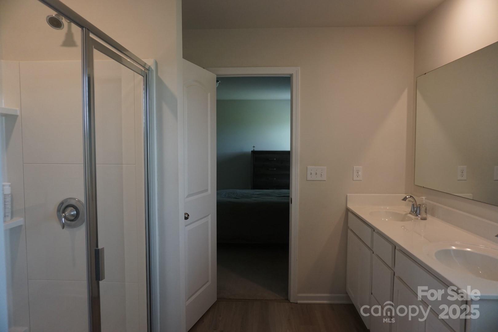 1276 Bryson Lane Denver, NC 28037 - Photo 9 of 16 a bathroom with a double vanity sink and mirror