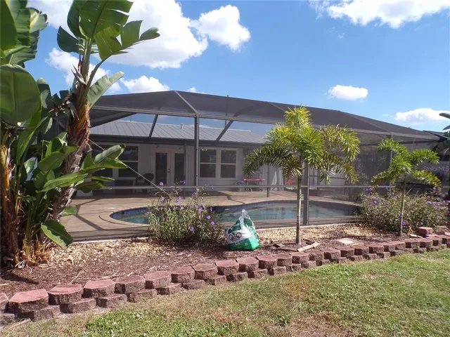 a view of swimming pool with a yard