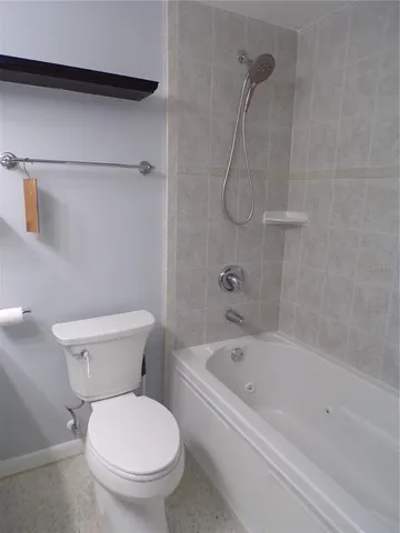 a kitchen with refrigerator a sink and cabinets