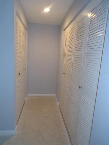 a view of an empty room and a window