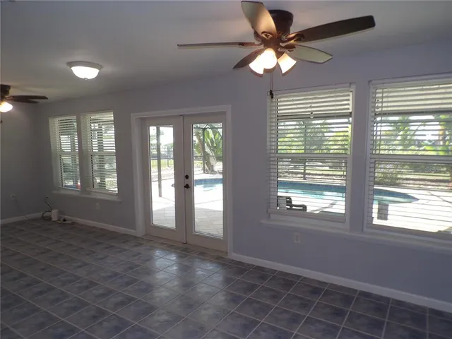 a view of an empty room with a window