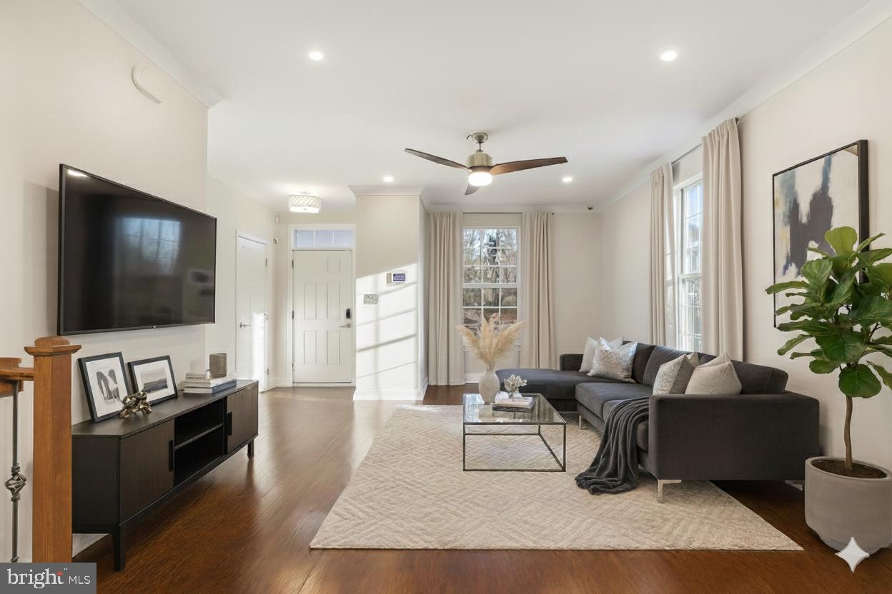 18060 Red Cedar Road Dumfries, VA 22026 - Photo 1 of 39 a living room with furniture and a flat screen tv