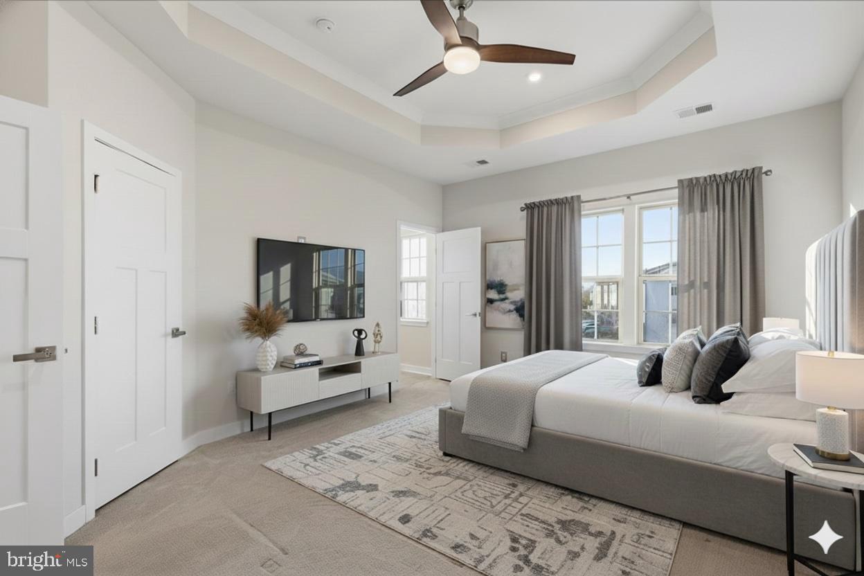 18060 Red Cedar Road Dumfries, VA 22026 - Photo 16 of 39 a bedroom with a bed and large window