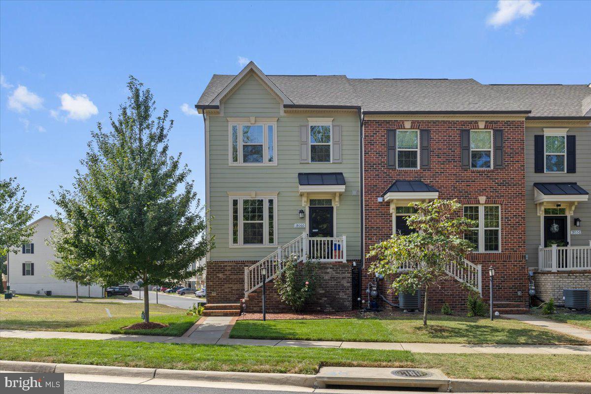 18060 Red Cedar Road Dumfries, VA 22026 - Photo 2 of 39 a front view of a house with a yard