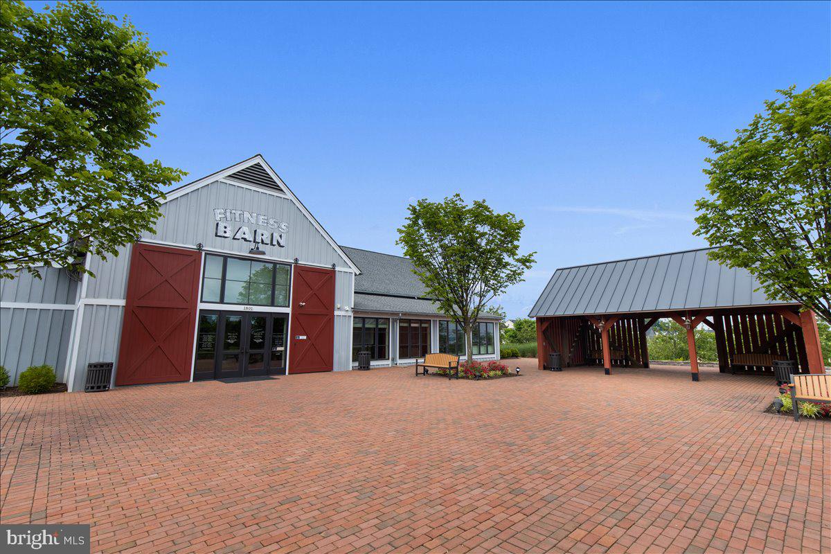 18060 Red Cedar Road Dumfries, VA 22026 - Photo 32 of 39 a front view of a house with a yard