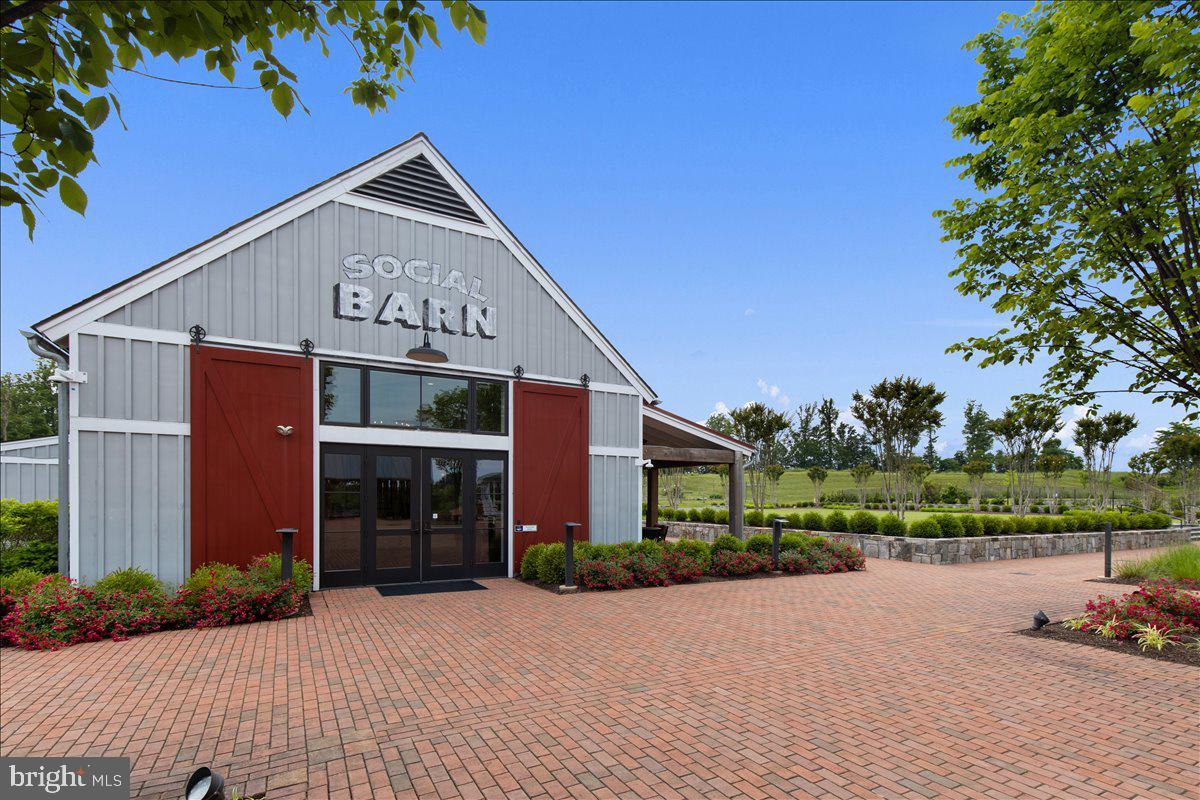 18060 Red Cedar Road Dumfries, VA 22026 - Photo 33 of 39 front view of a house with a yard