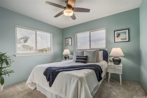 a bed room with a bed and a window