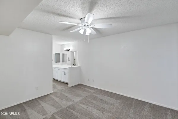 a bathroom with a toilet sink shower and mirror