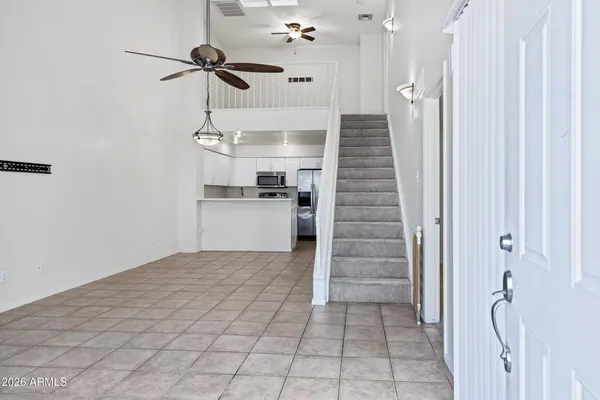 a view of an empty room with a fireplace