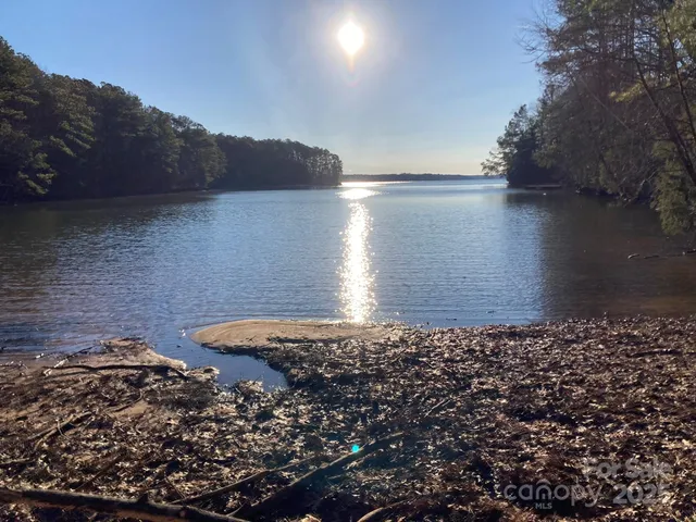 a view of a wooden floor and a lake view