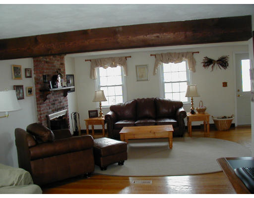 23 Rack Road Chelmsford, MA 01824 - Photo 3 of 4 a living room with furniture and a fireplace