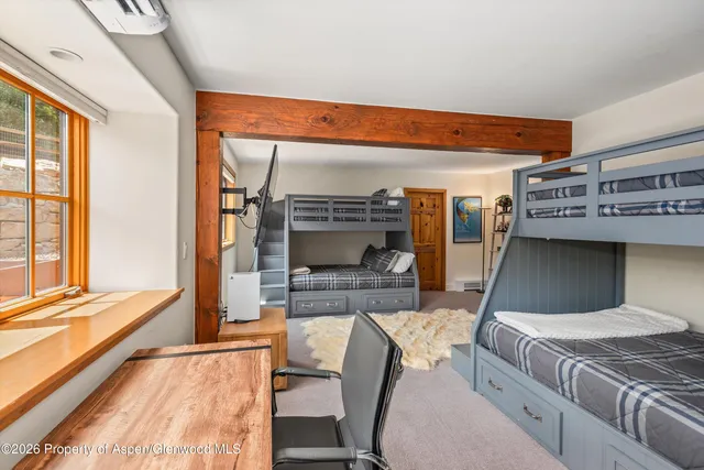a spacious bathroom with a double vanity sink mirror and shower