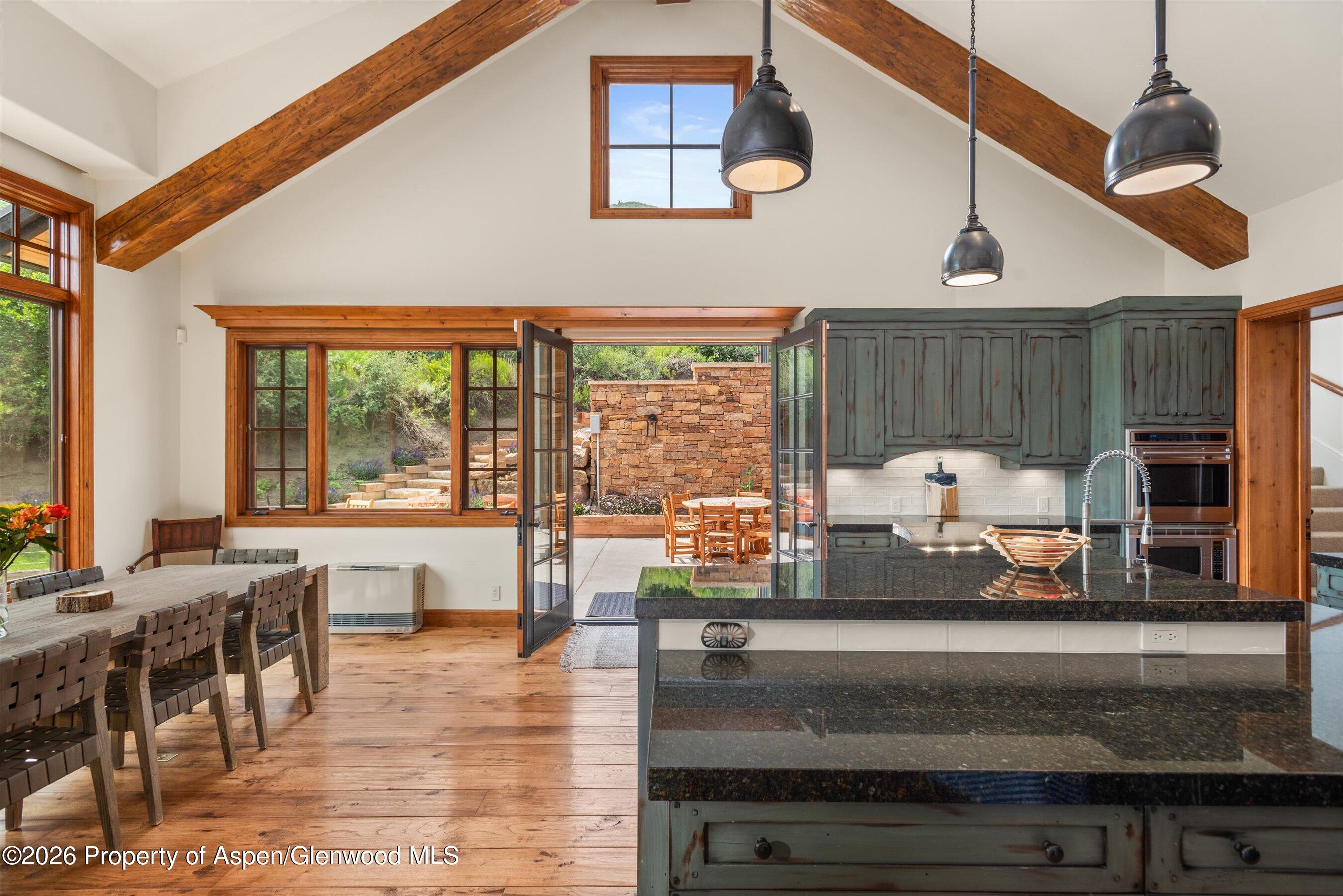 701 Brush Creek Road Aspen, CO 81611 - Photo 10 of 18 a living room with fireplace furniture and a large window