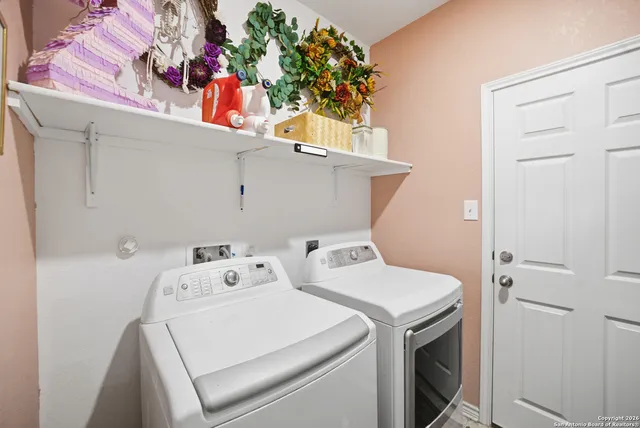 a utility room with dryer and washer