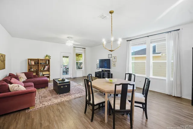 a view of a dining room with furniture window and wooden floor