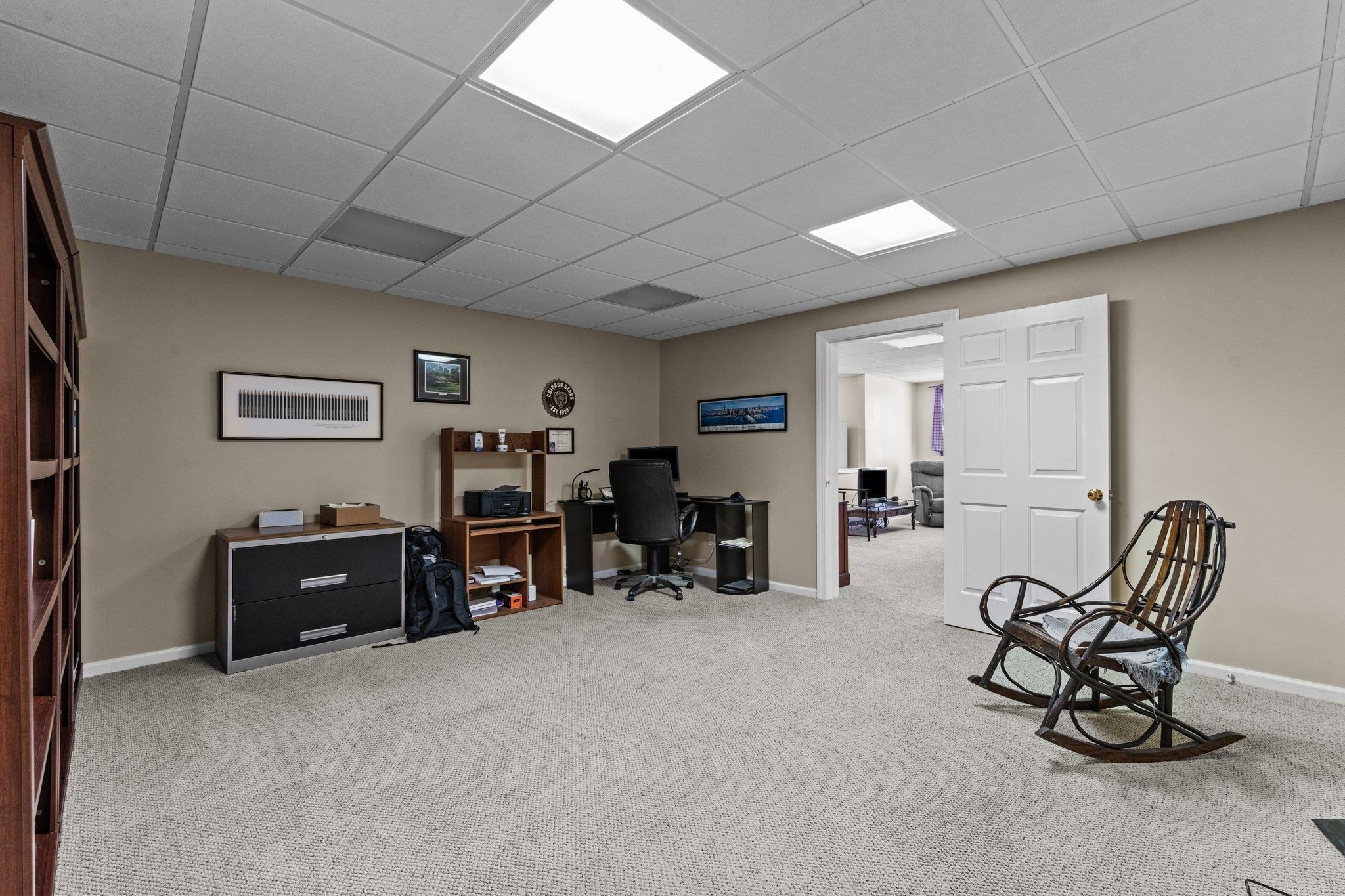 7509 Silver View Lane Raleigh, NC 27613 - Photo 29 of 39 a living room with furniture and a flat screen tv