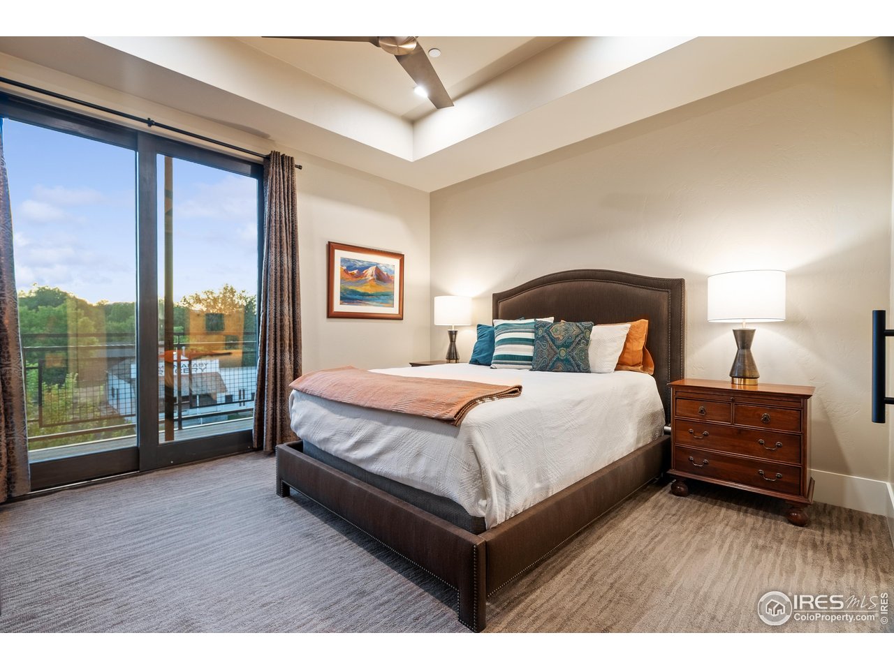 302 North Meldrum Street, Unit 304 Fort Collins, CO 80521 - Photo 13 of 31 Sliding doors to outside balcony with beautiful sunsets