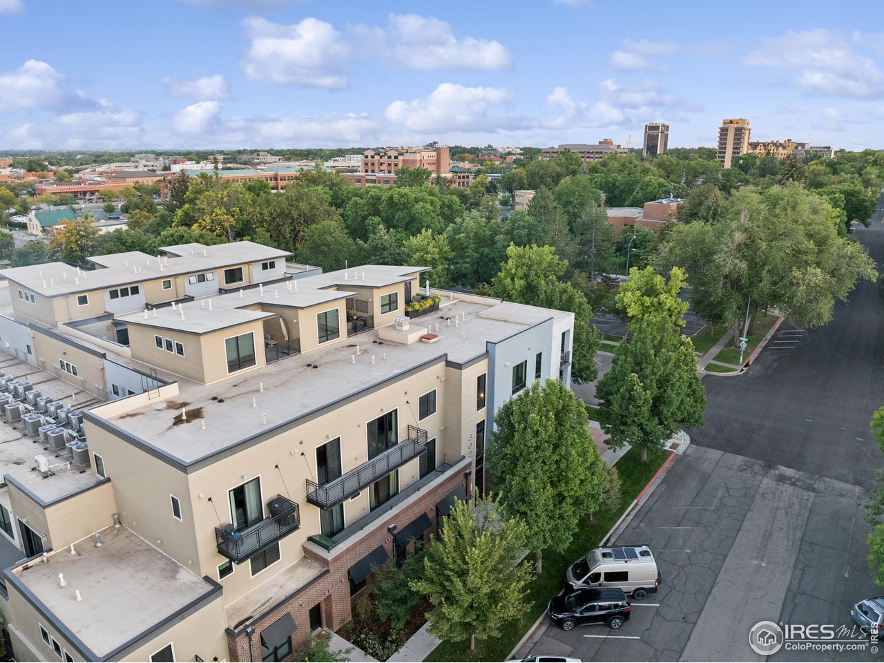302 North Meldrum Street, Unit 304 Fort Collins, CO 80521 - Photo 26 of 31 Condo Complex surrounded by mature landscape