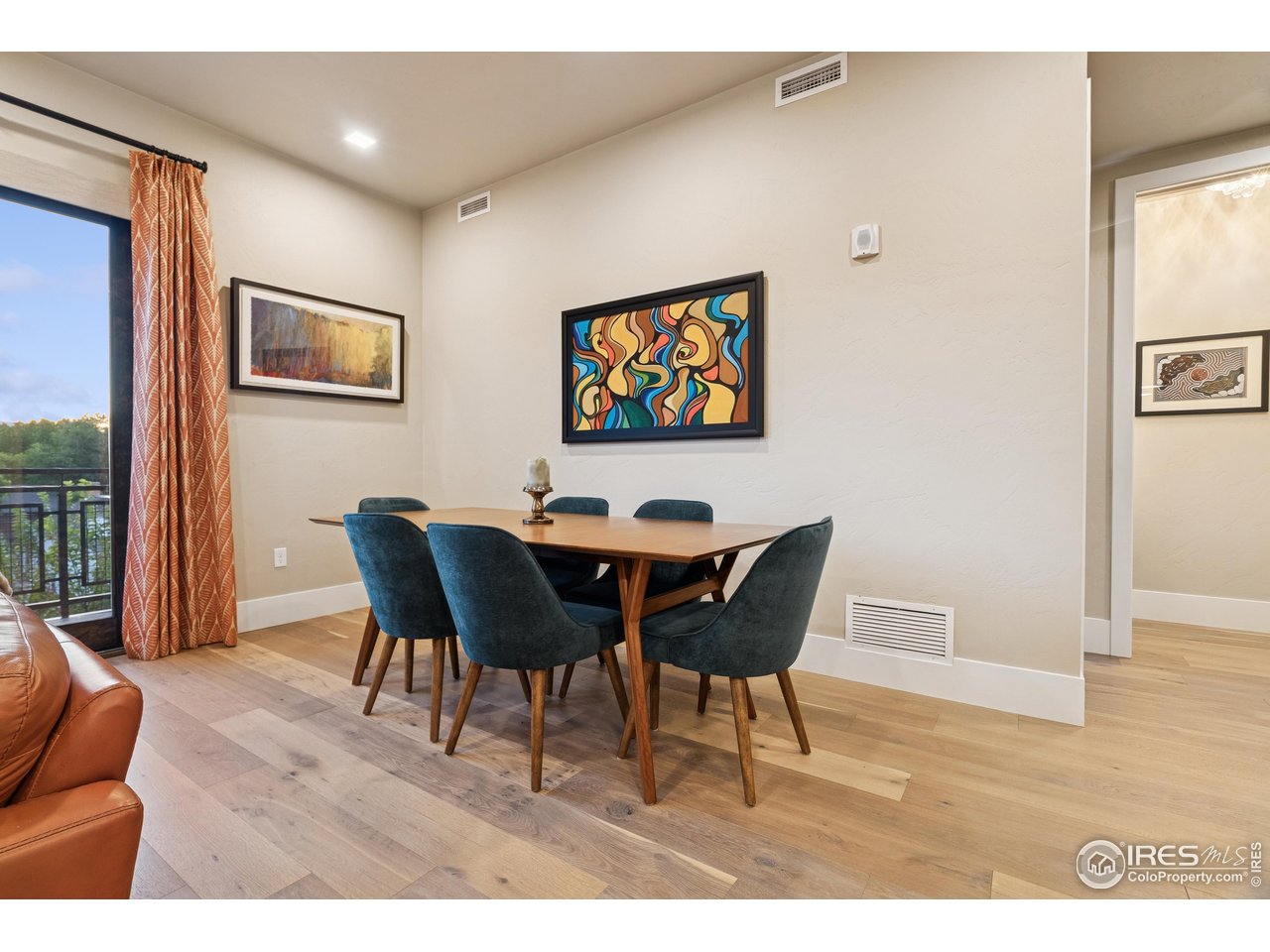 302 North Meldrum Street, Unit 304 Fort Collins, CO 80521 - Photo 6 of 31 a view of a dining room with furniture and wooden floor