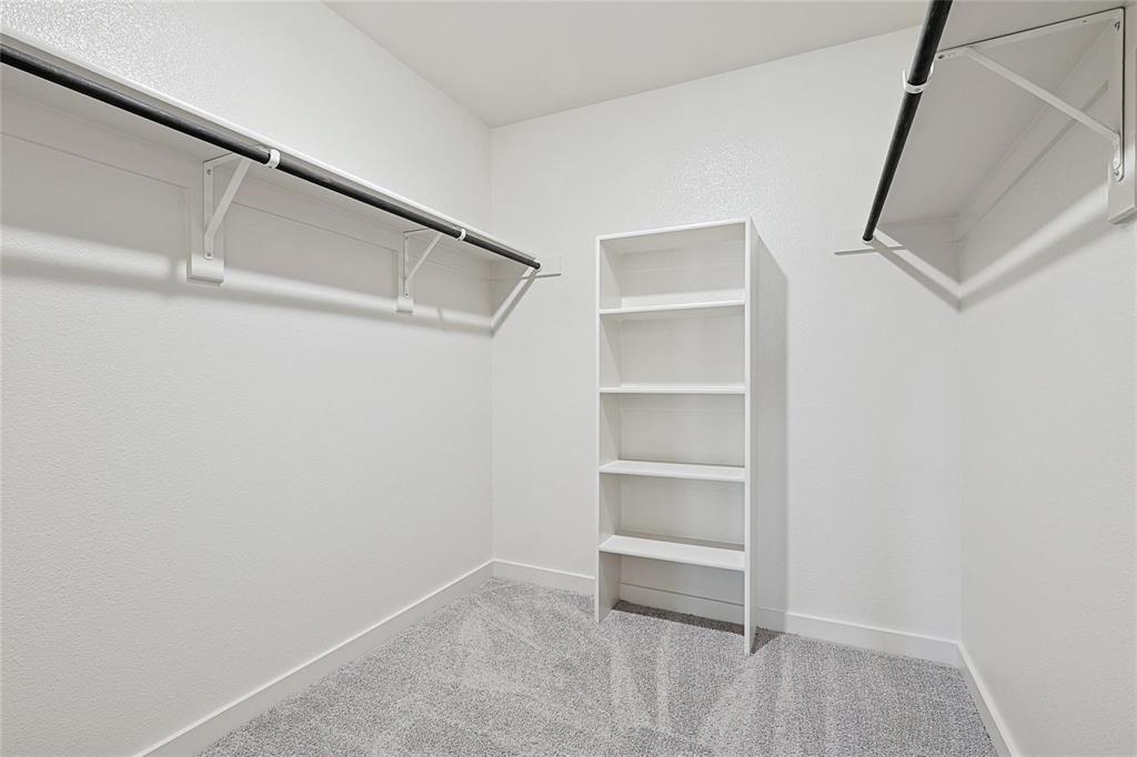 1759 Gleasondale Place Forney, TX 75126 - Photo 16 of 25 Walk in closet with light colored carpet