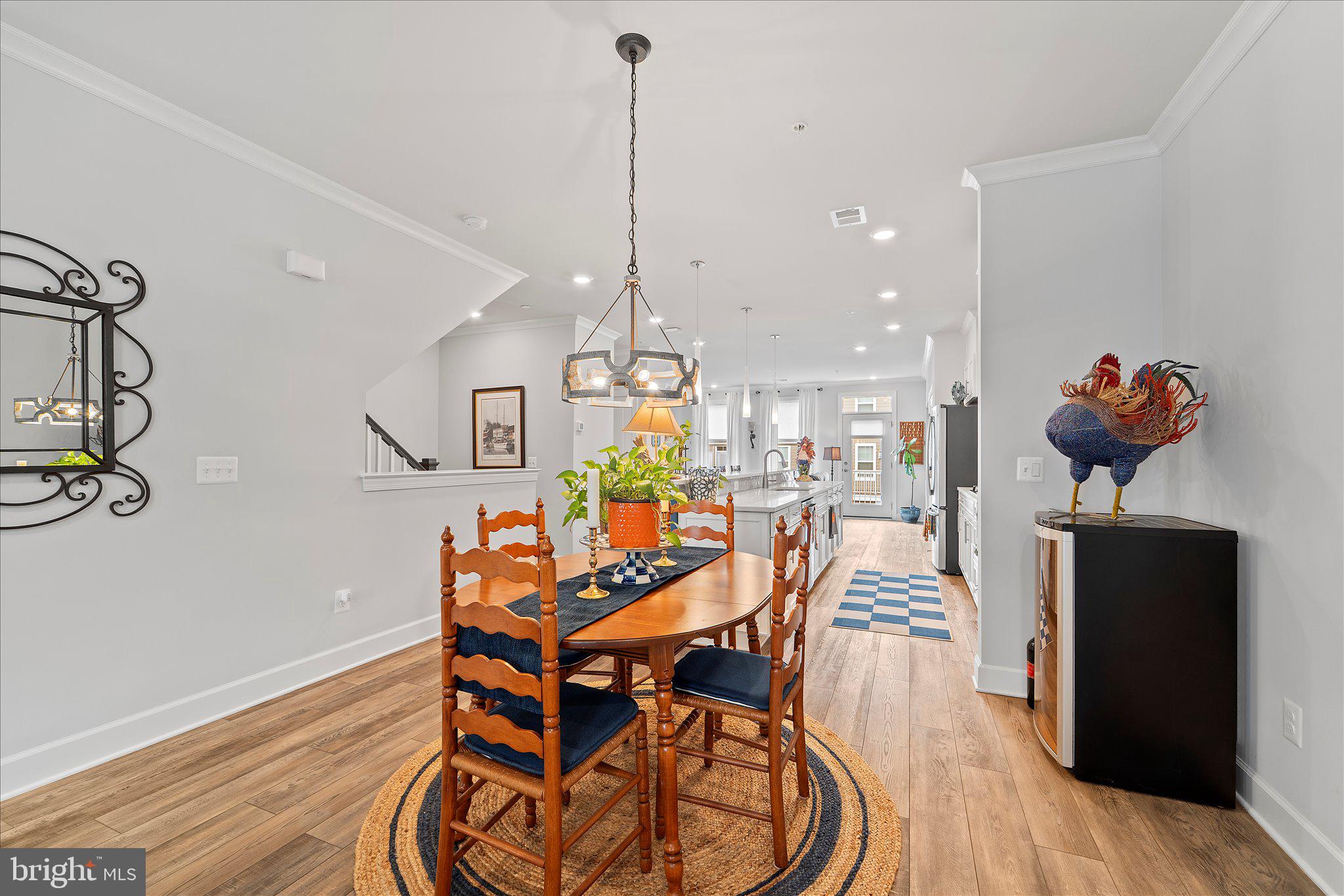 45206 Lettermore Square Sterling, VA 20166 - Photo 12 of 42 a view of a dining room with furniture and wooden floor