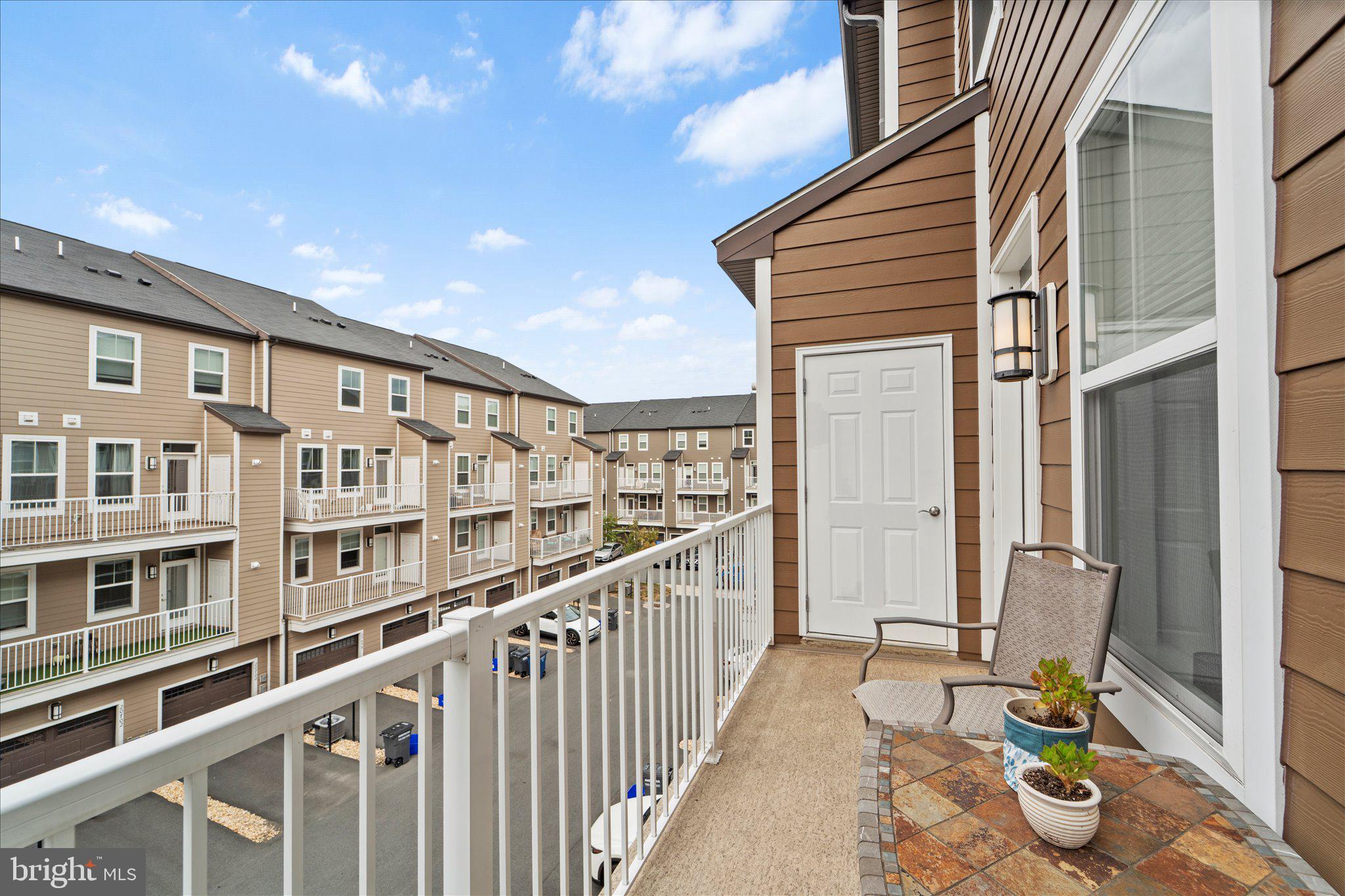45206 Lettermore Square Sterling, VA 20166 - Photo 18 of 42 a view of balcony with couch