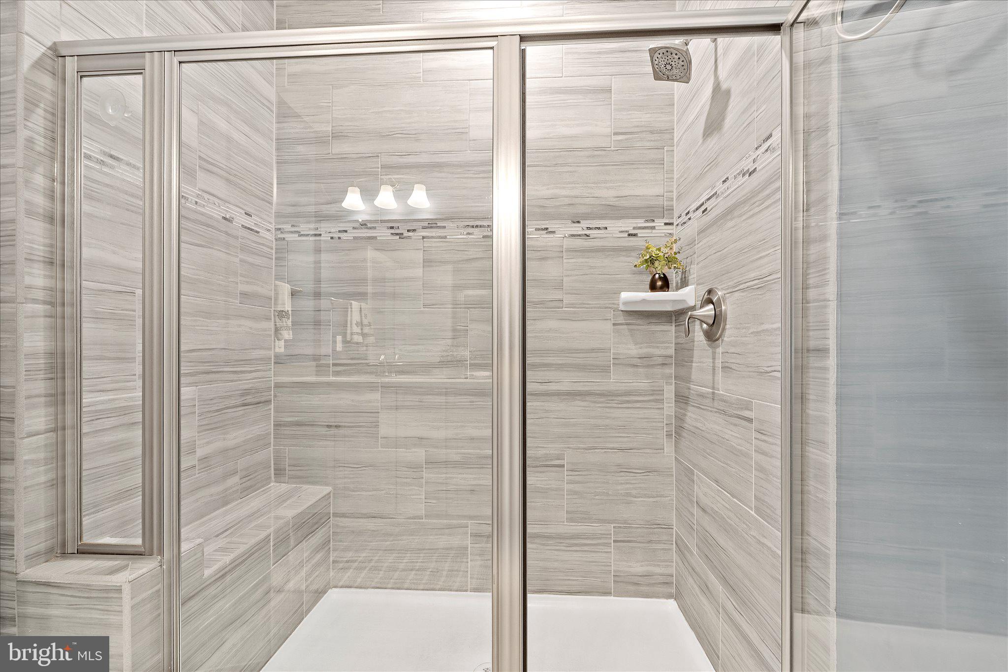 45206 Lettermore Square Sterling, VA 20166 - Photo 25 of 42 a bathroom with a glass shower door
