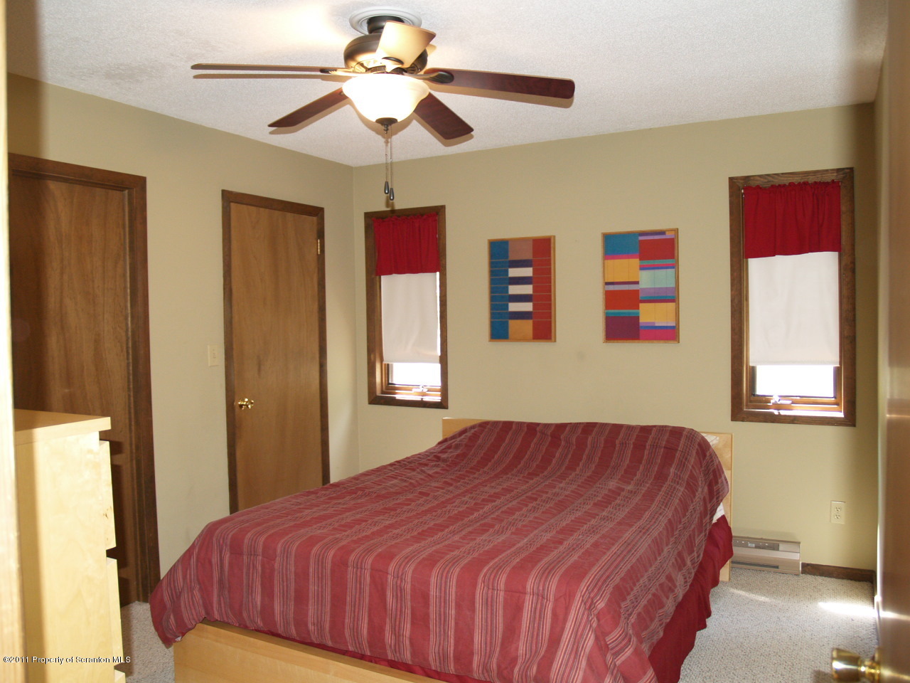 209 Ridgewood Circle Lake Ariel, PA 18436 - Photo 16 of 16 a bedroom with a bed and a chandelier