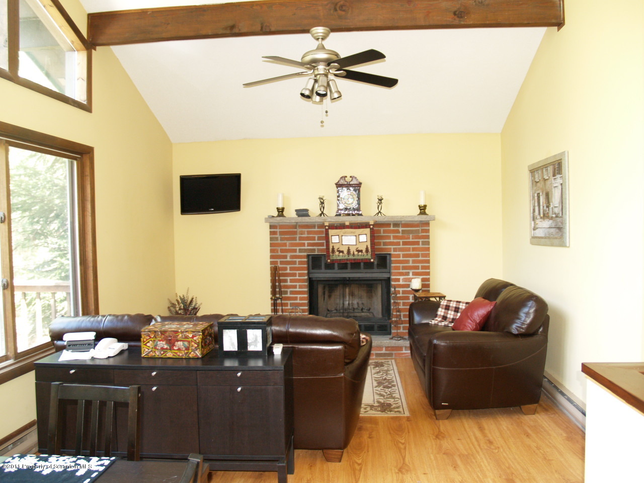 209 Ridgewood Circle Lake Ariel, PA 18436 - Photo 3 of 16 a living room with furniture and a fireplace