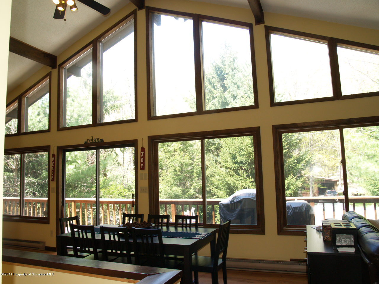 209 Ridgewood Circle Lake Ariel, PA 18436 - Photo 4 of 16 a view of a city from a dining room with large windows