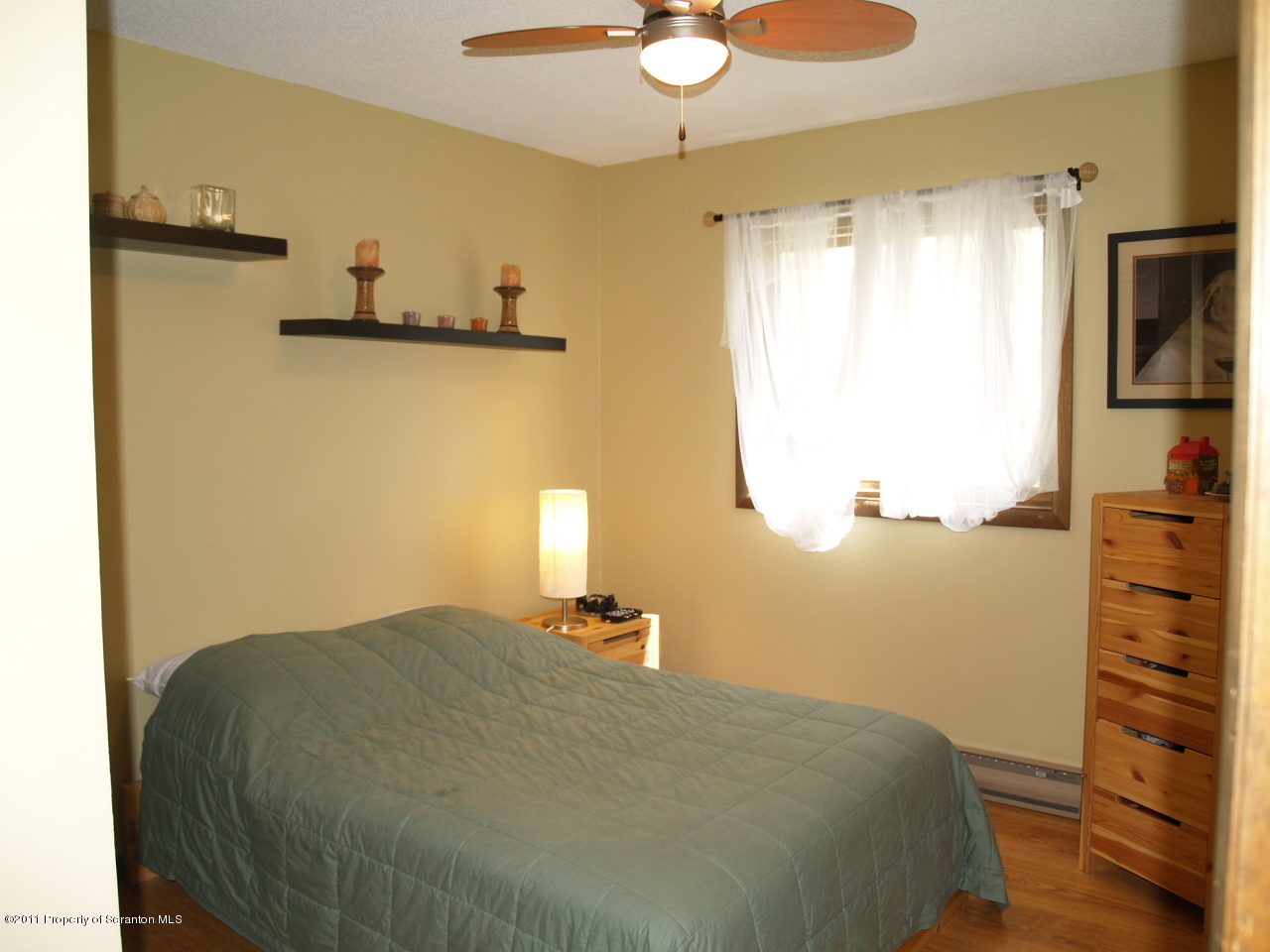 209 Ridgewood Circle Lake Ariel, PA 18436 - Photo 8 of 16 a bedroom with a bed and cabinets