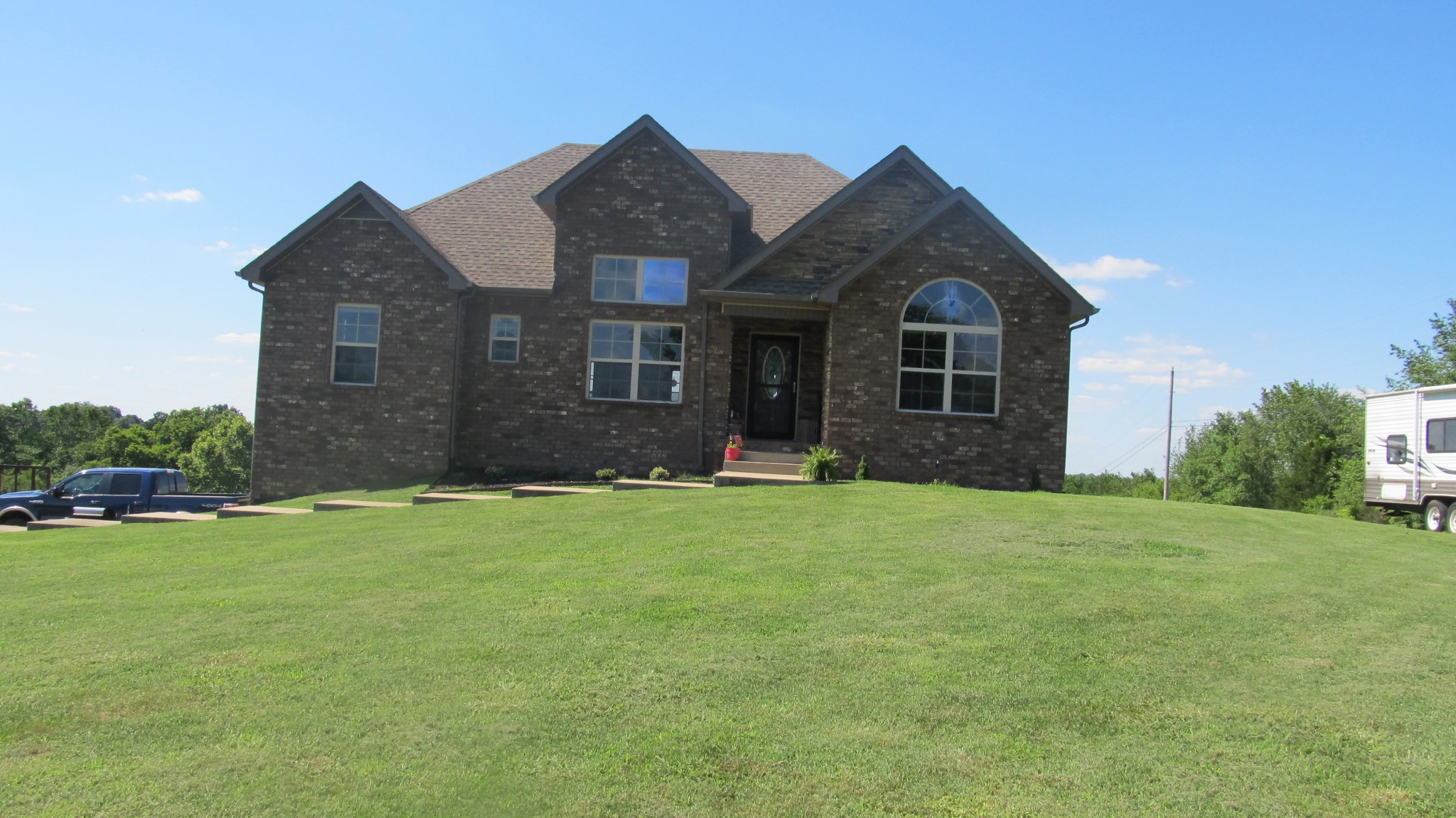 353 7 Mile Ferry Road Cunningham, TN 37052 - Photo 1 of 14 front view of a house with a yard