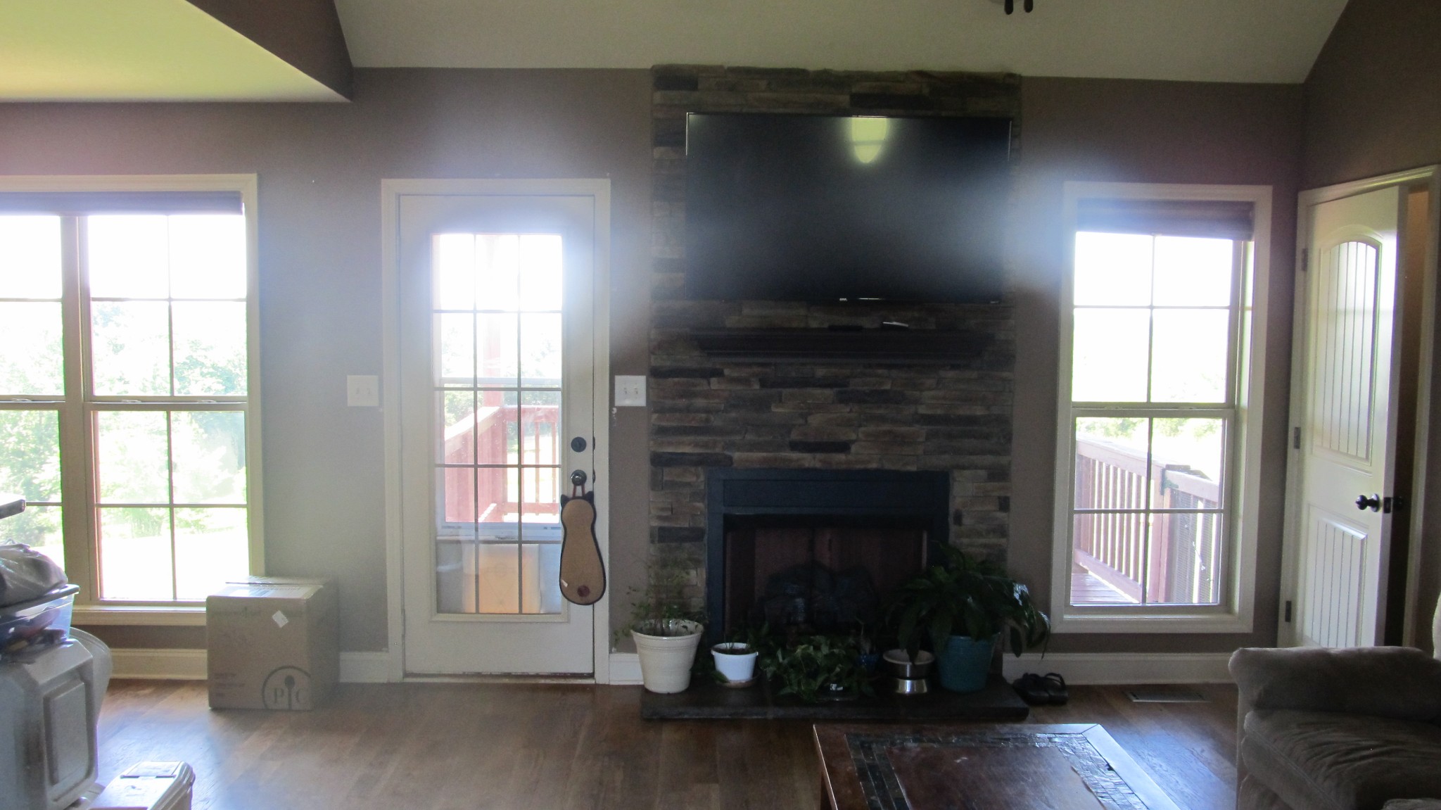 353 7 Mile Ferry Road Cunningham, TN 37052 - Photo 3 of 14 a living room with a fireplace and windows