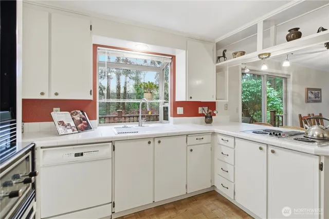 a bedroom with a bed a table and chair