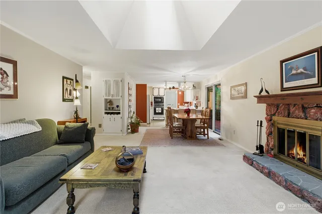 a view of a dining room with furniture and chandelier