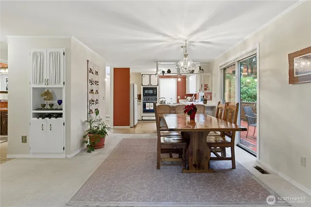 a kitchen with stainless steel appliances a stove microwave and refrigerator