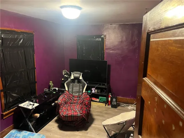 a room with furniture and gym equipment