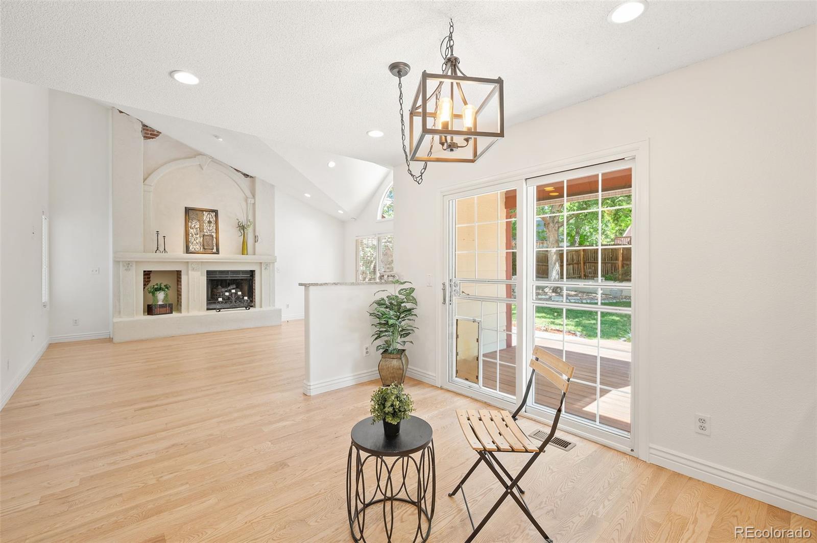 9368 Harvard Drive Highlands Ranch, CO 80130 - Photo 17 of 46 a view of a livingroom with furniture window and wooden floor