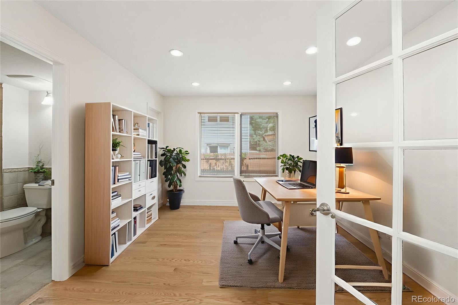 9368 Harvard Drive Highlands Ranch, CO 80130 - Photo 21 of 46 a view of a workspace with furniture and a window
