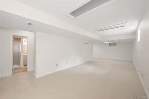 an empty room with a empty space and windows