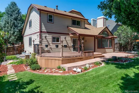 a front view of house with yard and outdoor seating