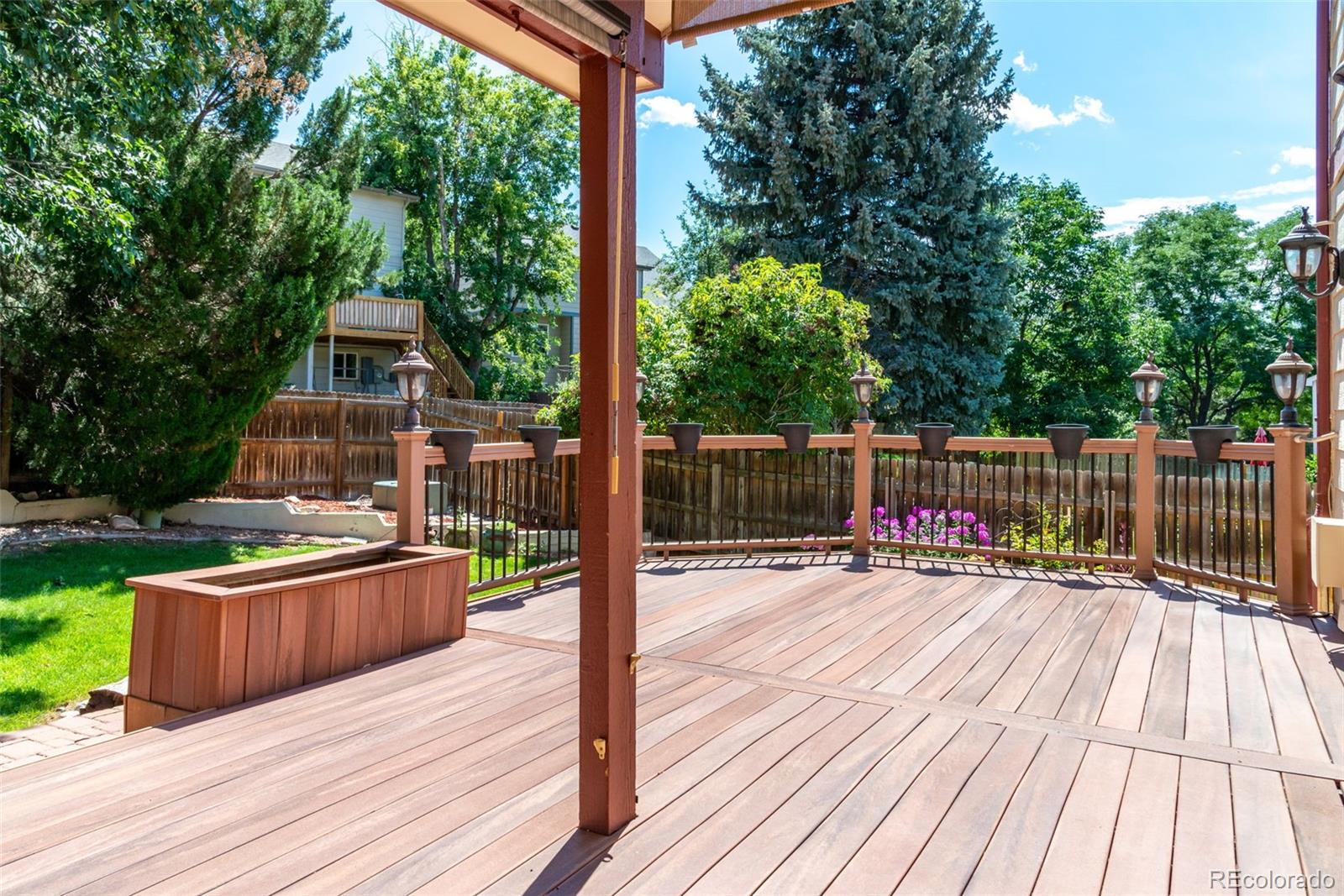 9368 Harvard Drive Highlands Ranch, CO 80130 - Photo 42 of 46 a view of a wooden deck with a bench