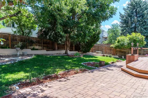 a view of a backyard with sitting area