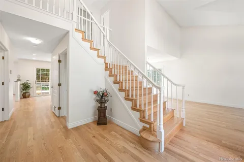 a view of entryway with wooden floor